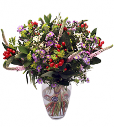 Arranjo de flores coloridas em vaso de vidro transparente