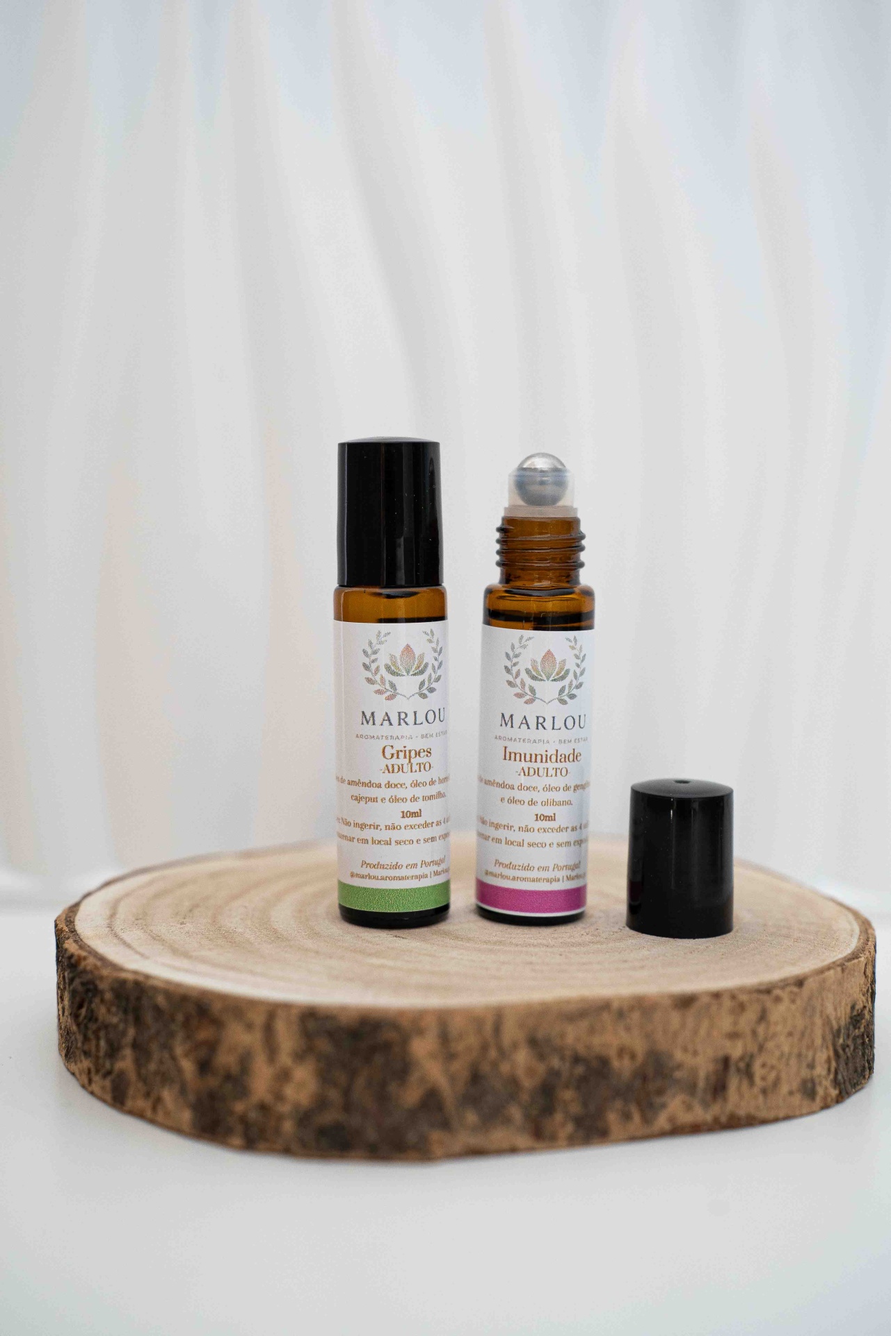 Kit Inverno Frascos de aromaterapia MARLOU com rótulos Gripes adulto e Imunidade adulto sobre tábua de madeira