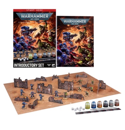 Warhammer 40,000 introductory set with miniatures, paints, dice, ruler, terrain, and box packaging