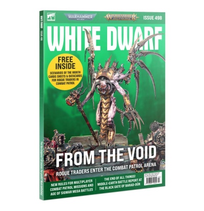 Capa da revista White Dwarf issue 498 com figura monstruosa e texto promocional