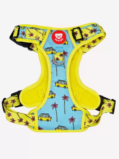 Peitoral para cão azul com bordas amarelas e estampado com carrinhas e palmeiras