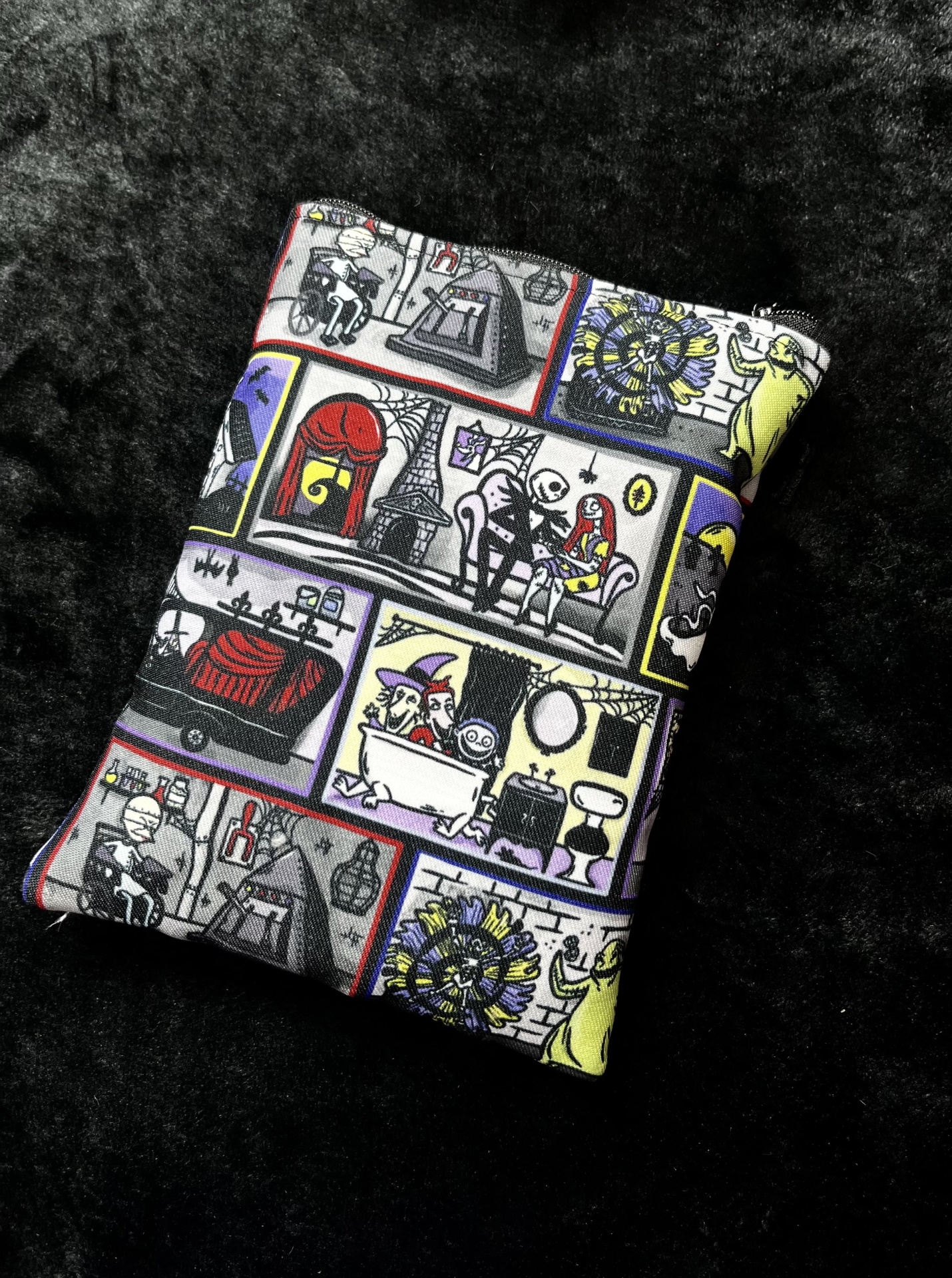 NBC Dollhouse E-Reader colorful rectangular fabric pouch with cartoon skeleton print on black background