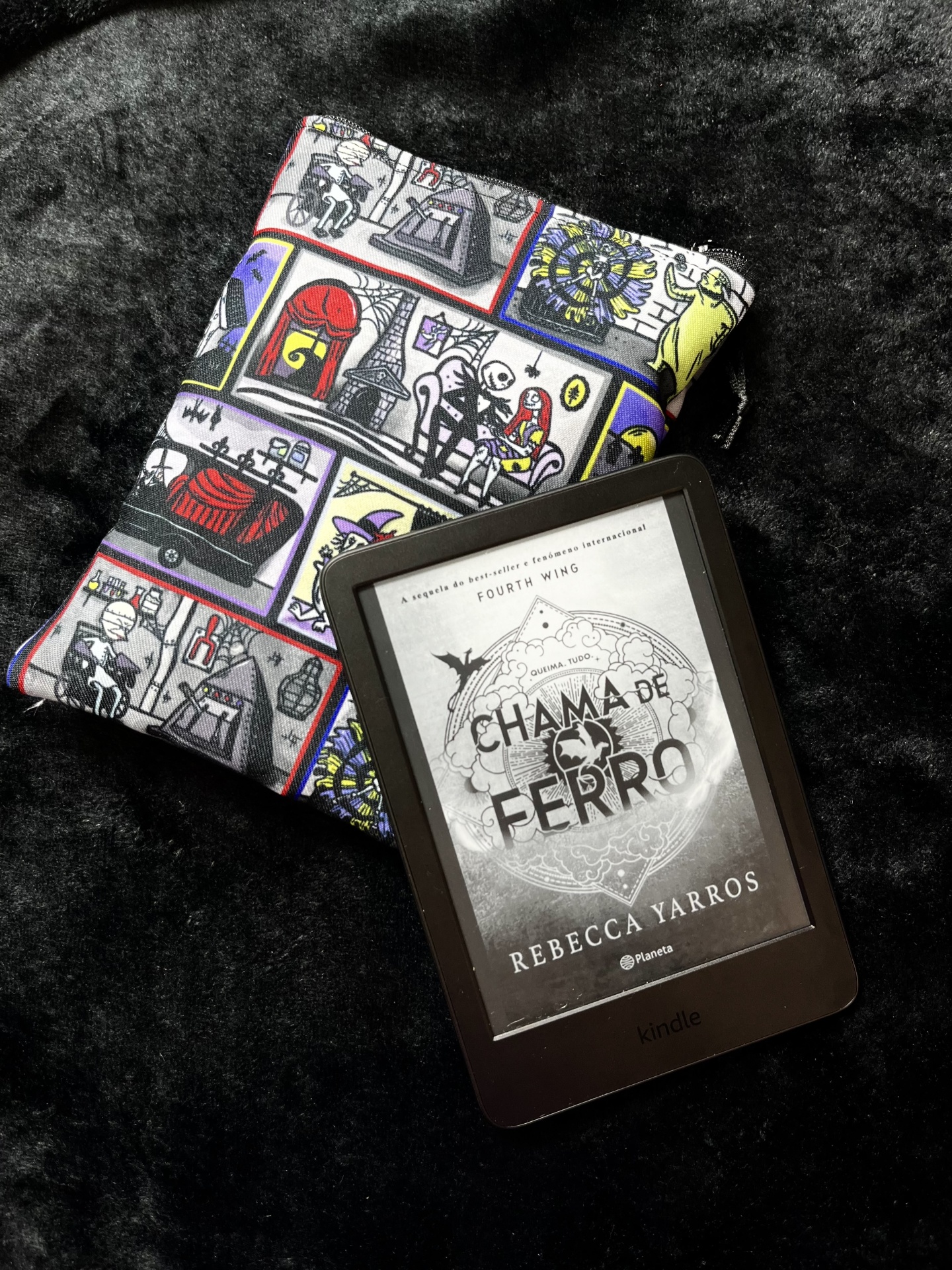 NBC Dollhouse E-Reader Kindle e-reader with CHAMA DE FERRO book cover and colorful cartoon fabric pouch on black fur background