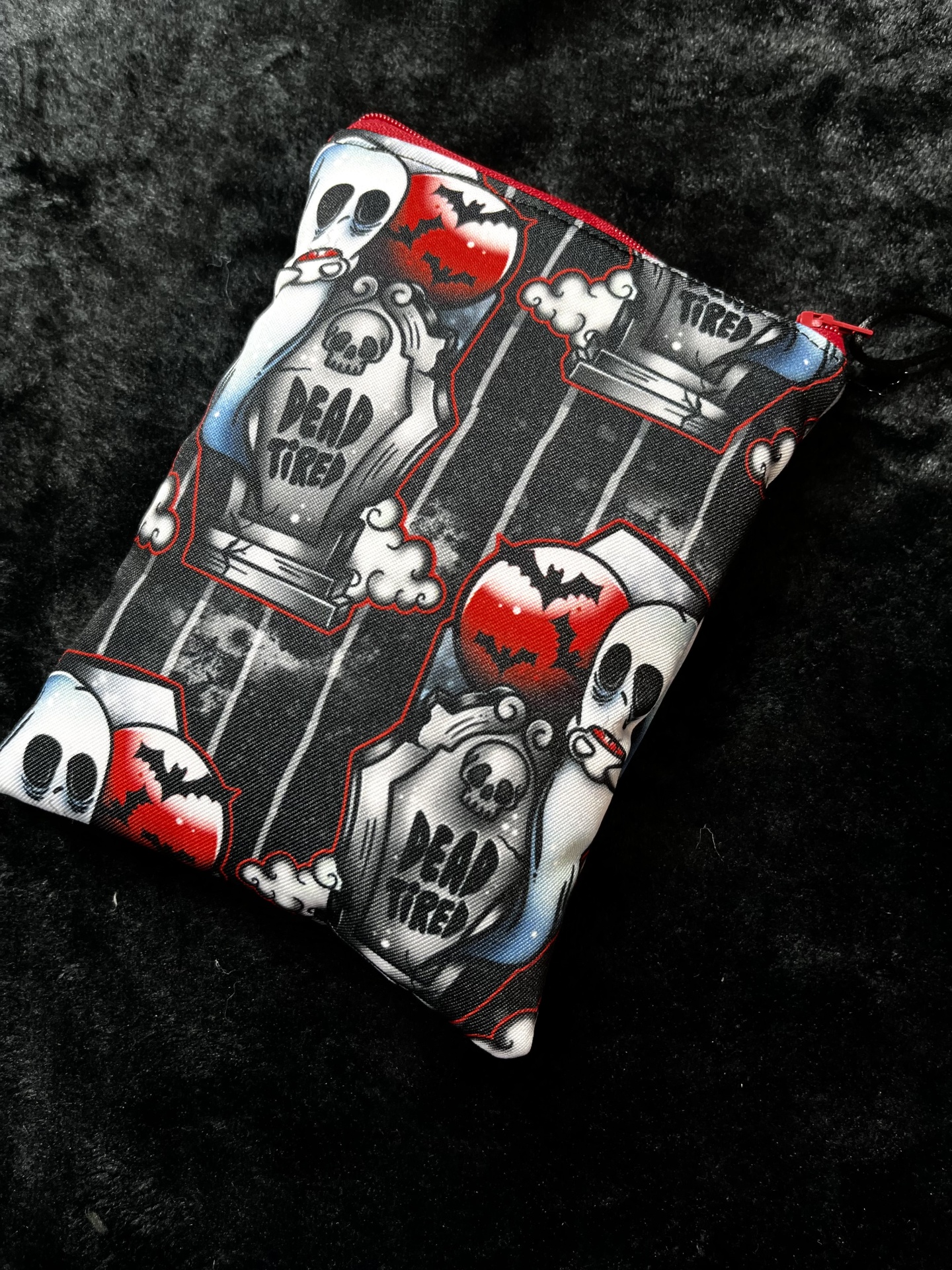 Dead Tired E-Reader Halloween-themed fabric pouch with ghosts, gravestones, bats and the text DEAD TIRED