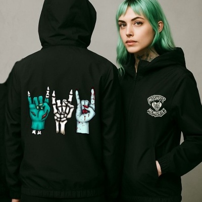 Two people in black hooded jackets with zombie hand graphics and MOSHPIT MEMORIES text on chest