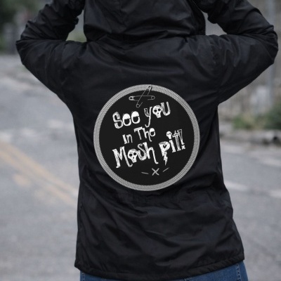 Black hooded jacket with See you in the Mosh Pit! patch on the back