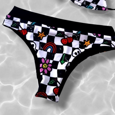 Checkered bikini bottom with colorful playful icons on water surface