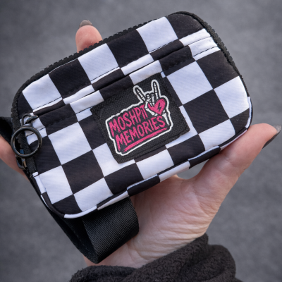 Black and white checkered pouch with MOSHPIT MEMORIES patch and zipper.