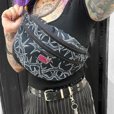 Black fanny pack with white pattern and MOSH PITS & MEMORIES patch worn crossbody