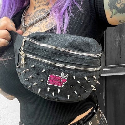 Black leather spike-studded fanny pack with MOSHPIT MEMORIES patch worn across chest