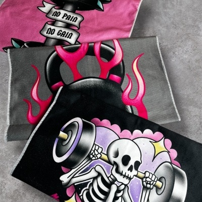 Three colorful fitness towels with kettlebell, skeleton lifting barbell, and NO PAIN NO GAIN dumbbell designs
