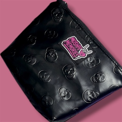 black pouch with embossed skulls and MOSHIP MEMORIES patch