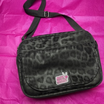 Black leopard print crossbody bag with MOSHPIT MEMORIES patch on magenta background