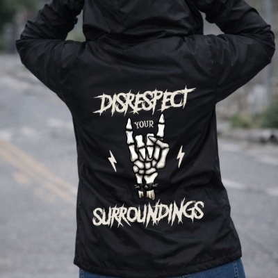 Black hooded jacket with skeleton hand graphic and text on back