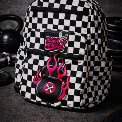 Checkered backpack with MOSHPIT MEMORIES patch and flame design on front pocket.