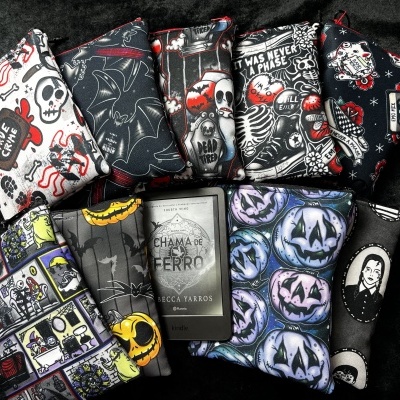 Colorful fabric Kindle cases with Halloween and gothic designs and text on a dark background.