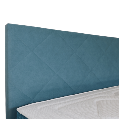 Cabeceira de cama azul estofada com colchão branco