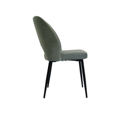 Cadeira estofada verde com pernas pretas vista de lado