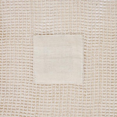 Pano de cozinha bege com padrão de gomo e bolso quadrado