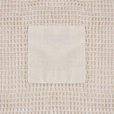 Tecido bege creme em padrão de rede com quadrado central liso
