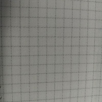 Caderno branco com padrão quadriculado cinza