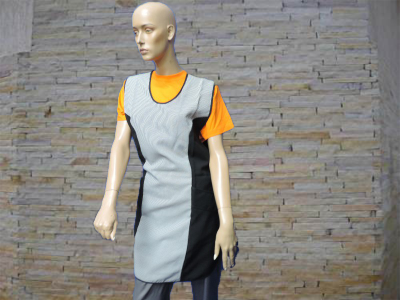 Mannequin wearing a textured gray and black dress over an orange t-shirt