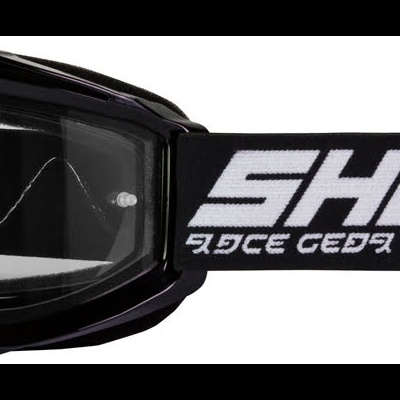 Óculos de proteção pretos com lente transparente e correia preta com texto branco