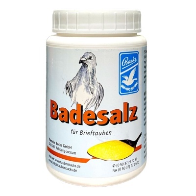 Frasco branco com rótulo branco e azul, texto Badesalz, imagem de pomba e colher com sal amarelo.