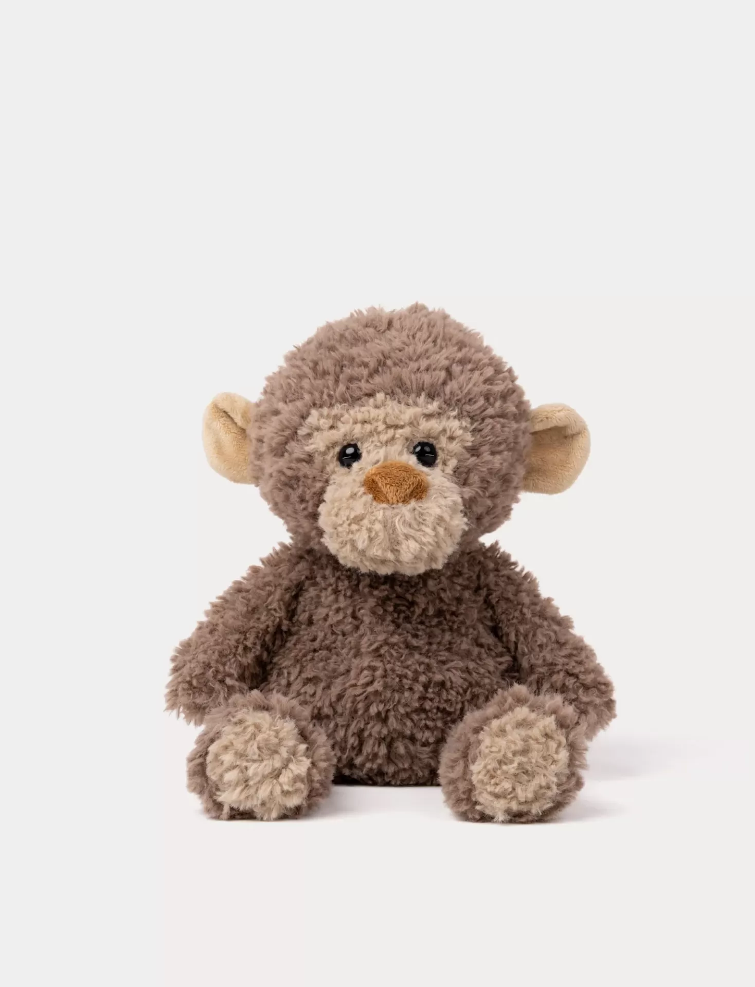 Peluche de macaco castanho sentado