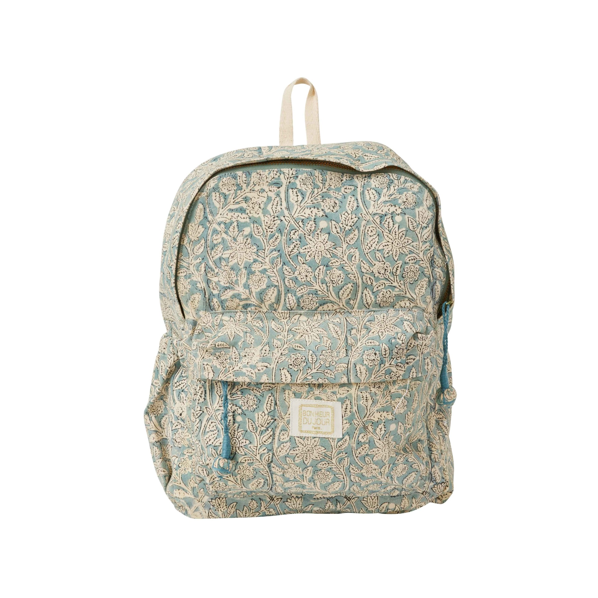 Mochila de tecido azul com padrão floral bege e etiqueta BONHEUR DU JOUR