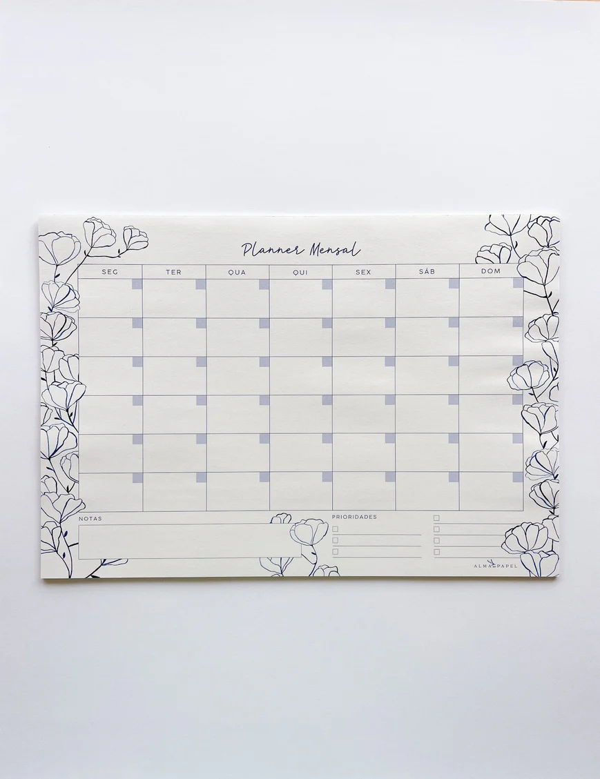 Planner mensal em papel branco com desenho de flores a preto e calendário semanal