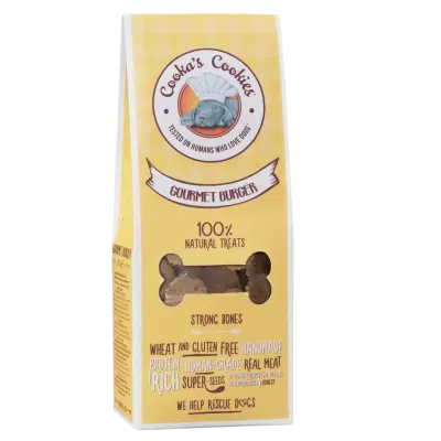 Embalagem amarela de biscoitos para cães com texto e janela em forma de osso mostrando biscoitos.