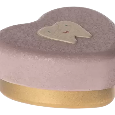Escova de dentes em forma de coração cor-de-rosa com dente sorridente