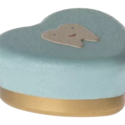 Caixa de metal azul claro com tampa em forma de dente sorridente