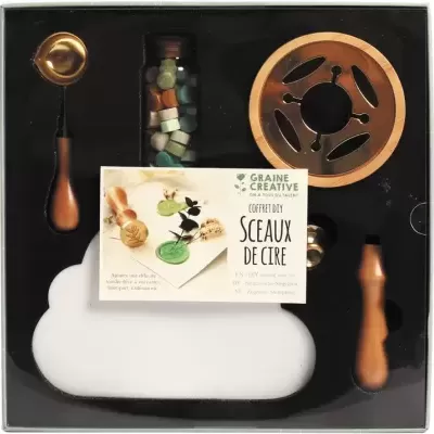 Conjunto DIY de selos de cera com ferramentas de madeira e pellets coloridos numa caixa preta.