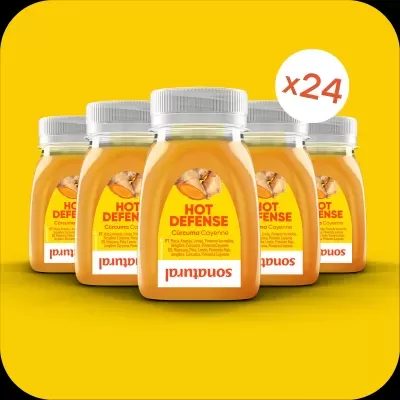 Frascos de suplemento Hot Defense com curcuma em fundo amarelo