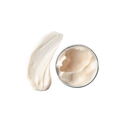 Creme cosmético branco em recipiente redondo metálico e amostra ao lado