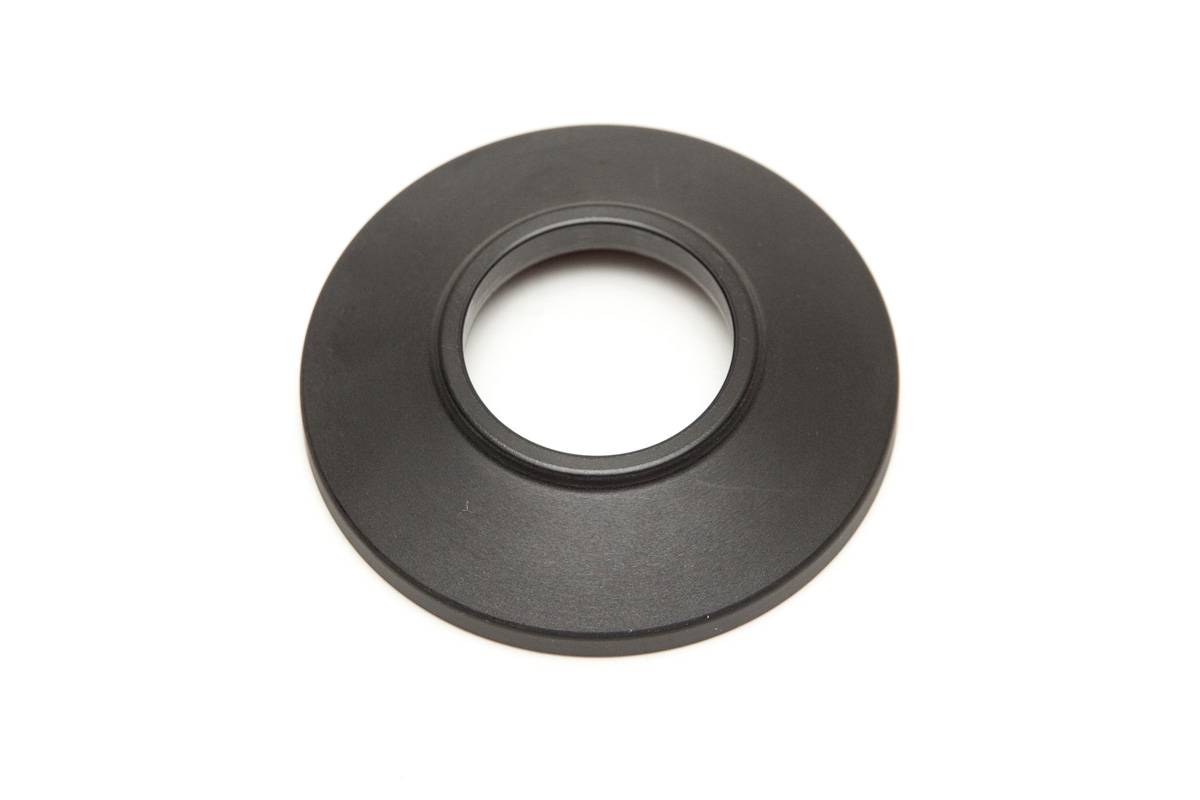 FRONT NYLON HUBGUARD Disco circular preto com orifício central sobre fundo branco