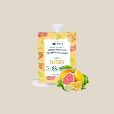 Máscara facial em saco plástico colorido com frutas cítricas e texto visível