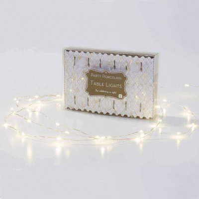 Conjunto de luzes decorativas brancas em porcelana para mesa numa caixa decorativa