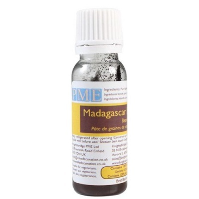 Frasco pequeno de vidro com líquida castanho escuro e tampa branca