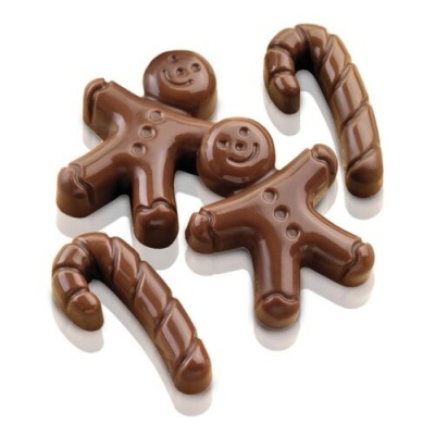 Peças de chocolate em forma de bonecos de gengibre e bengalas