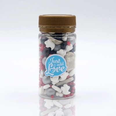 Frasco plástico com confeitos em forma de ossos coloridos e etiqueta 'Just add Love'