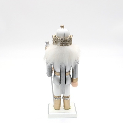 Figura de quebra-nozes de costas com coroa dourada e cabelo branco