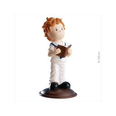 Figura decorativa de menino a segurar um livro