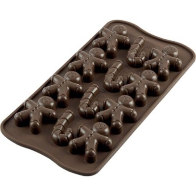 Forma silicone castanha com cavidades de biscoitos bonecos e bastões de doces