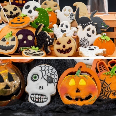 Biscoitos decorados e esculturas temáticas de Halloween em abóboras, fantasmas, caveiras e gatos pretos