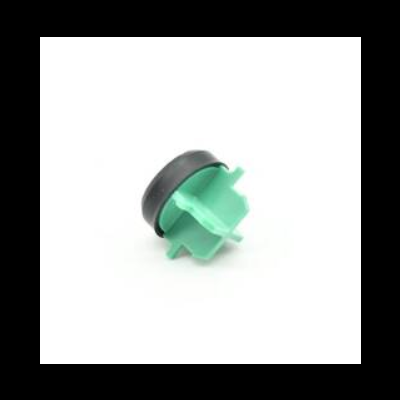 Peça de plástico verde com base circular preta
