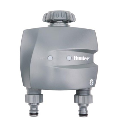 Distribuidor de água cinzento da marca Hunter com botão grande e duas ligações na parte inferior