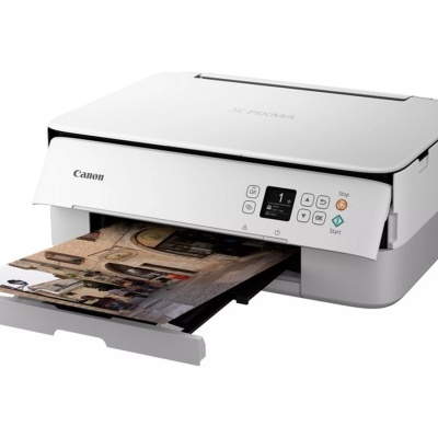 Impressora Canon multifunções branca a imprimir fotografia colorida